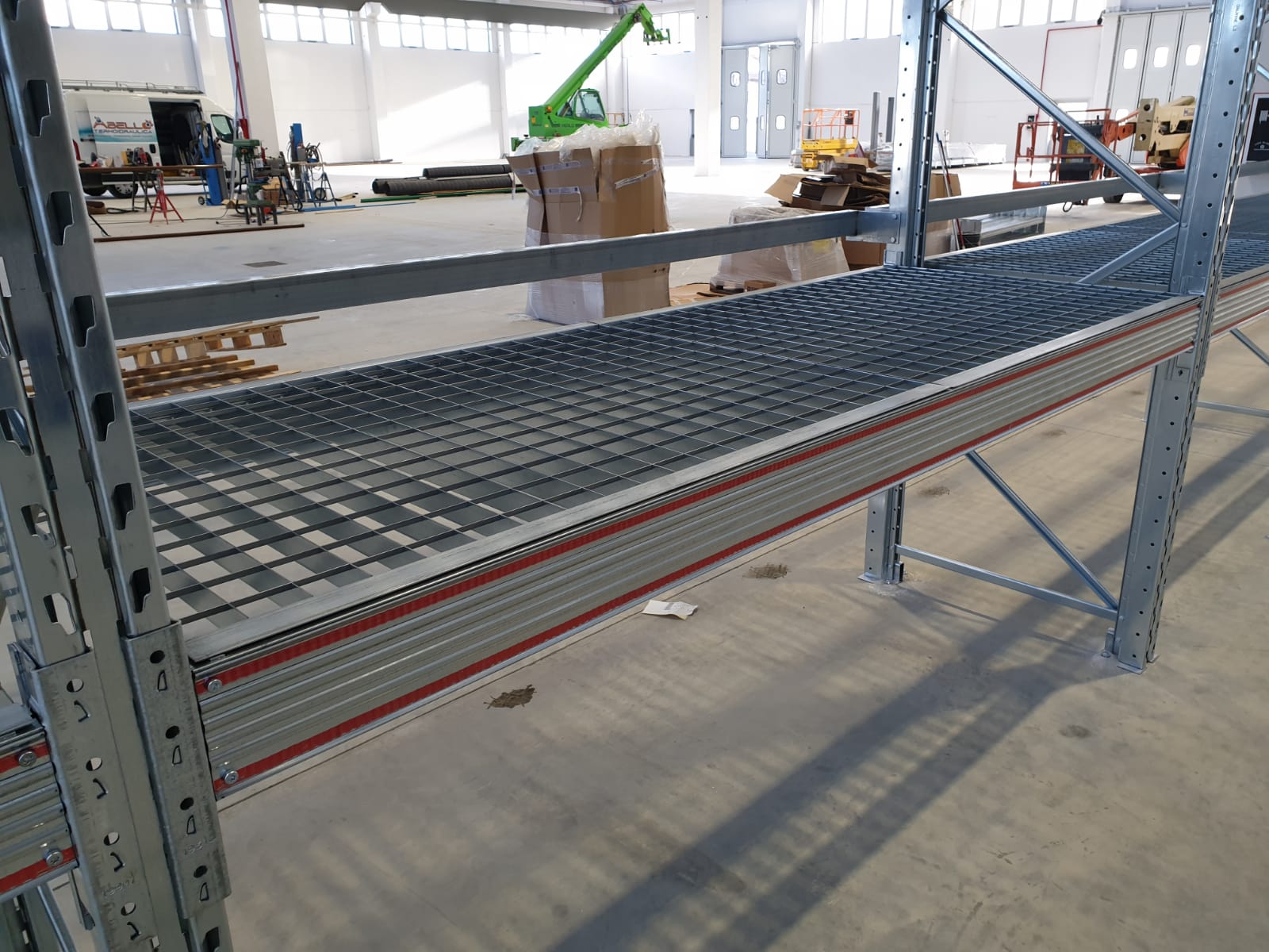 Pallet backstops for racking